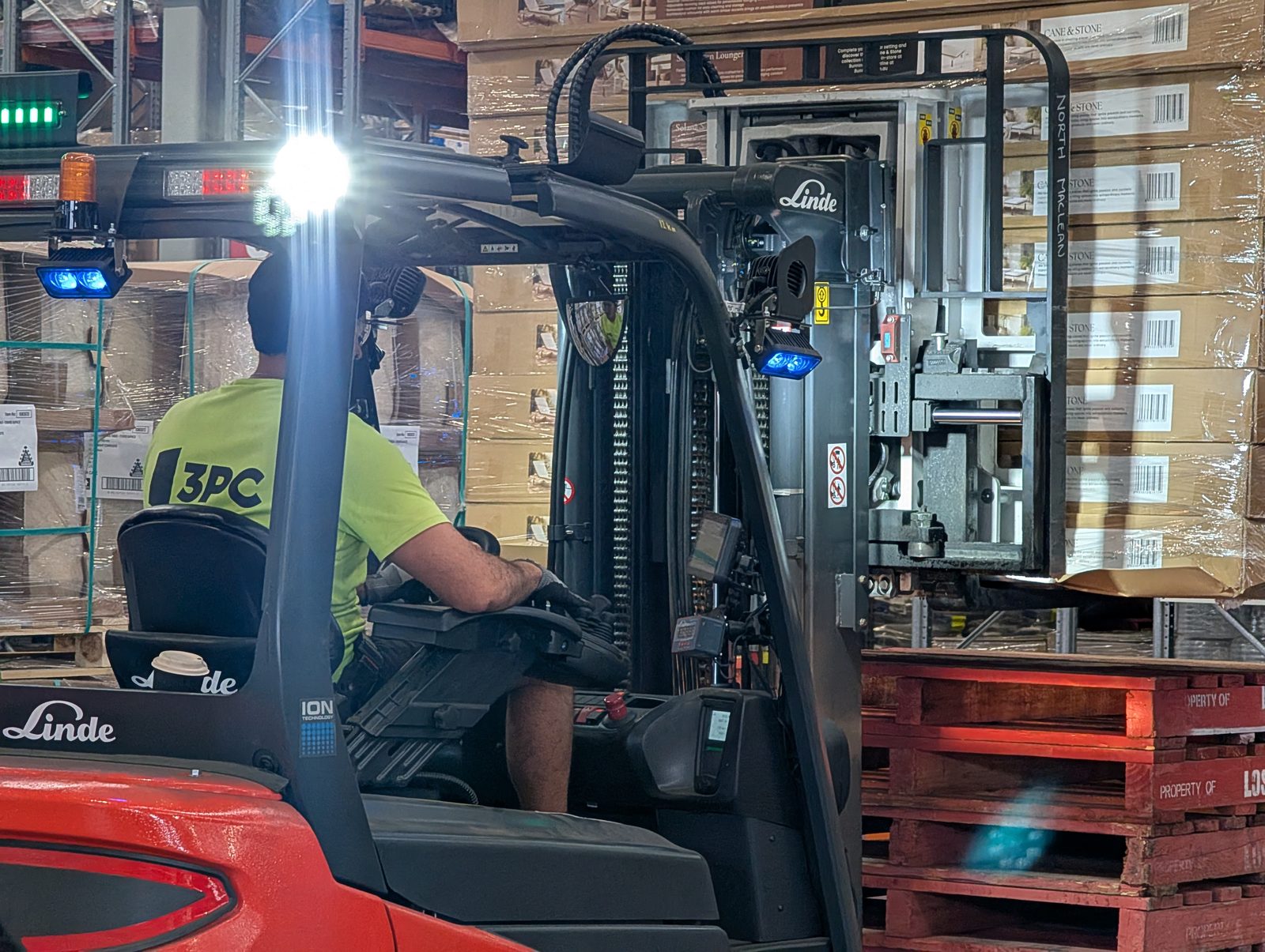 3PC forklift operator working inside a customer distribution centre