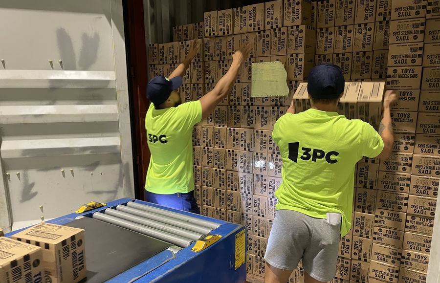 3PC crew unloading a shipping container