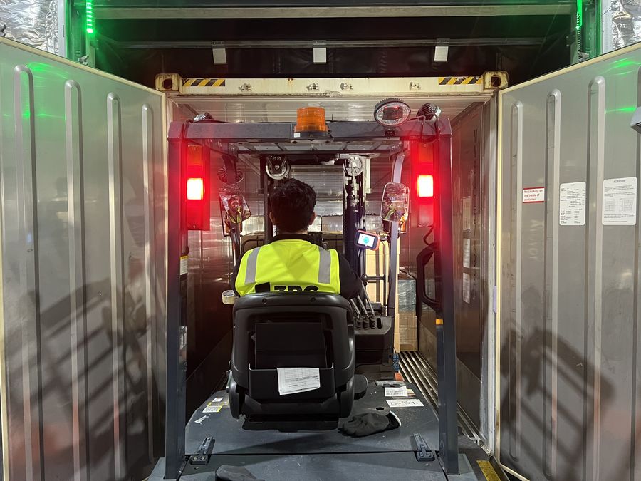 3PC forklift entering a warehouse aisle